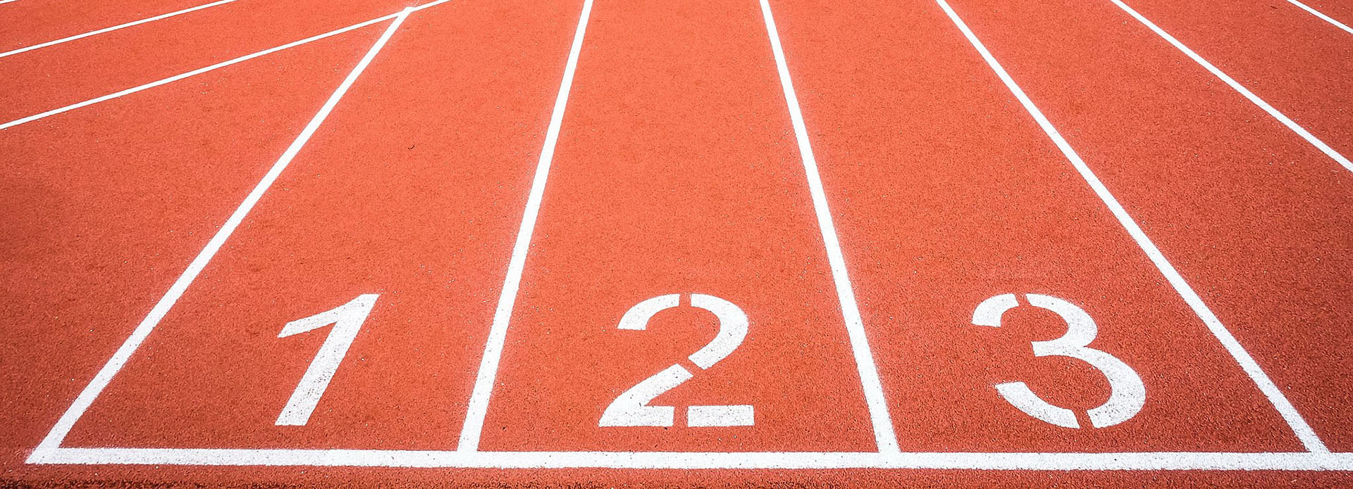 Photo of outdoor running track centered on lanes marked 1, 2, and 3